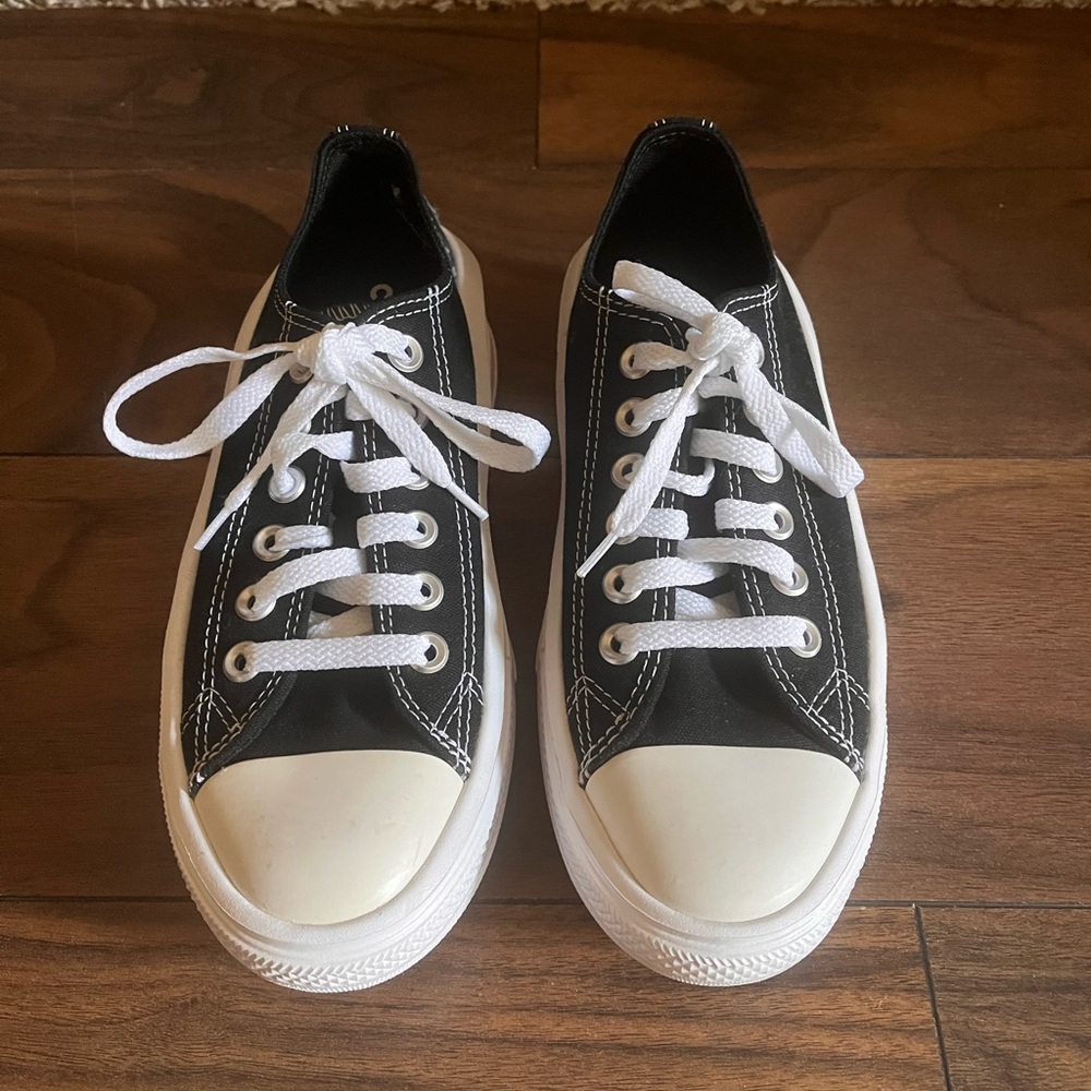 Black and White Low-Top Platform Converse Sneakers.
